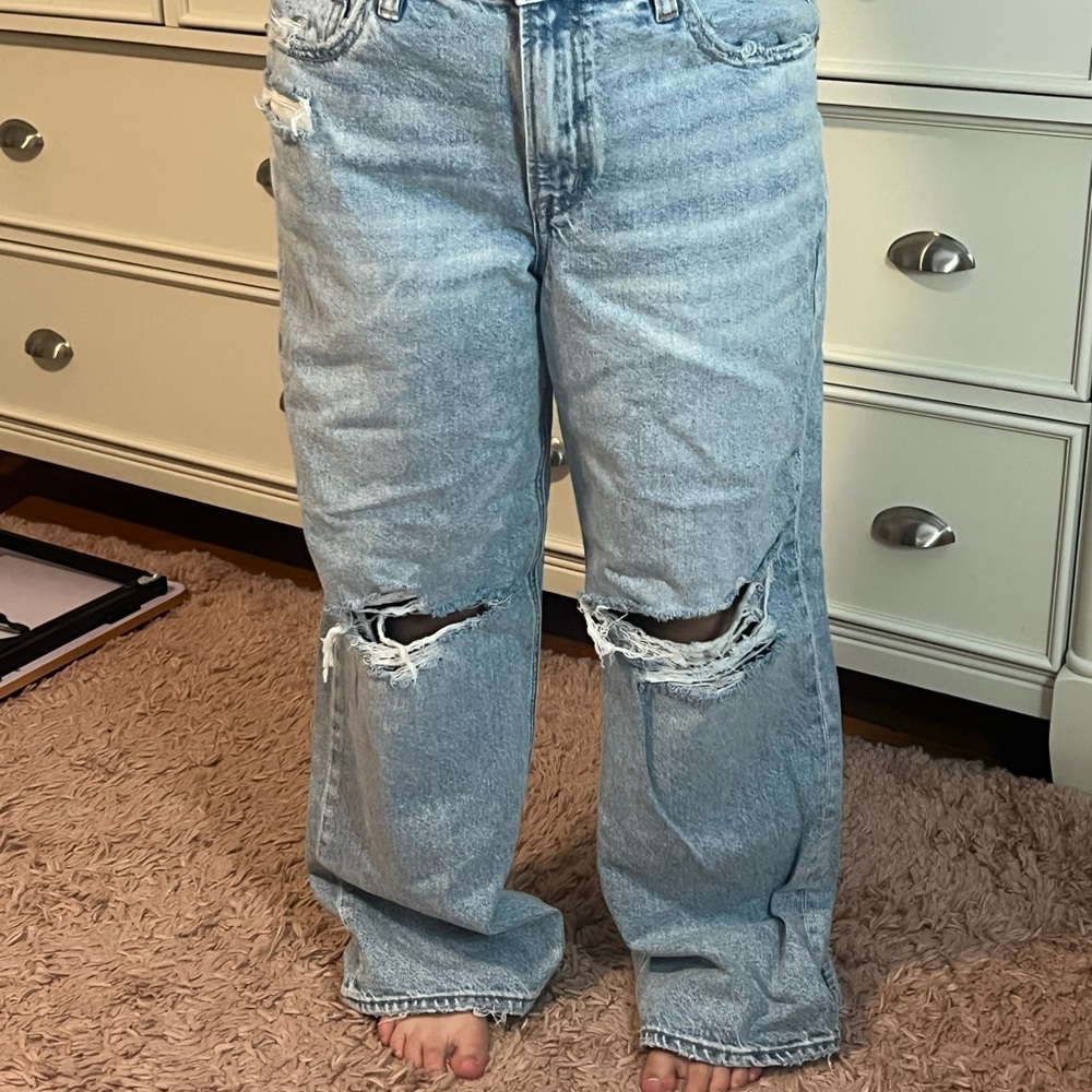 Woman’s Distressed Light Blue Jeans